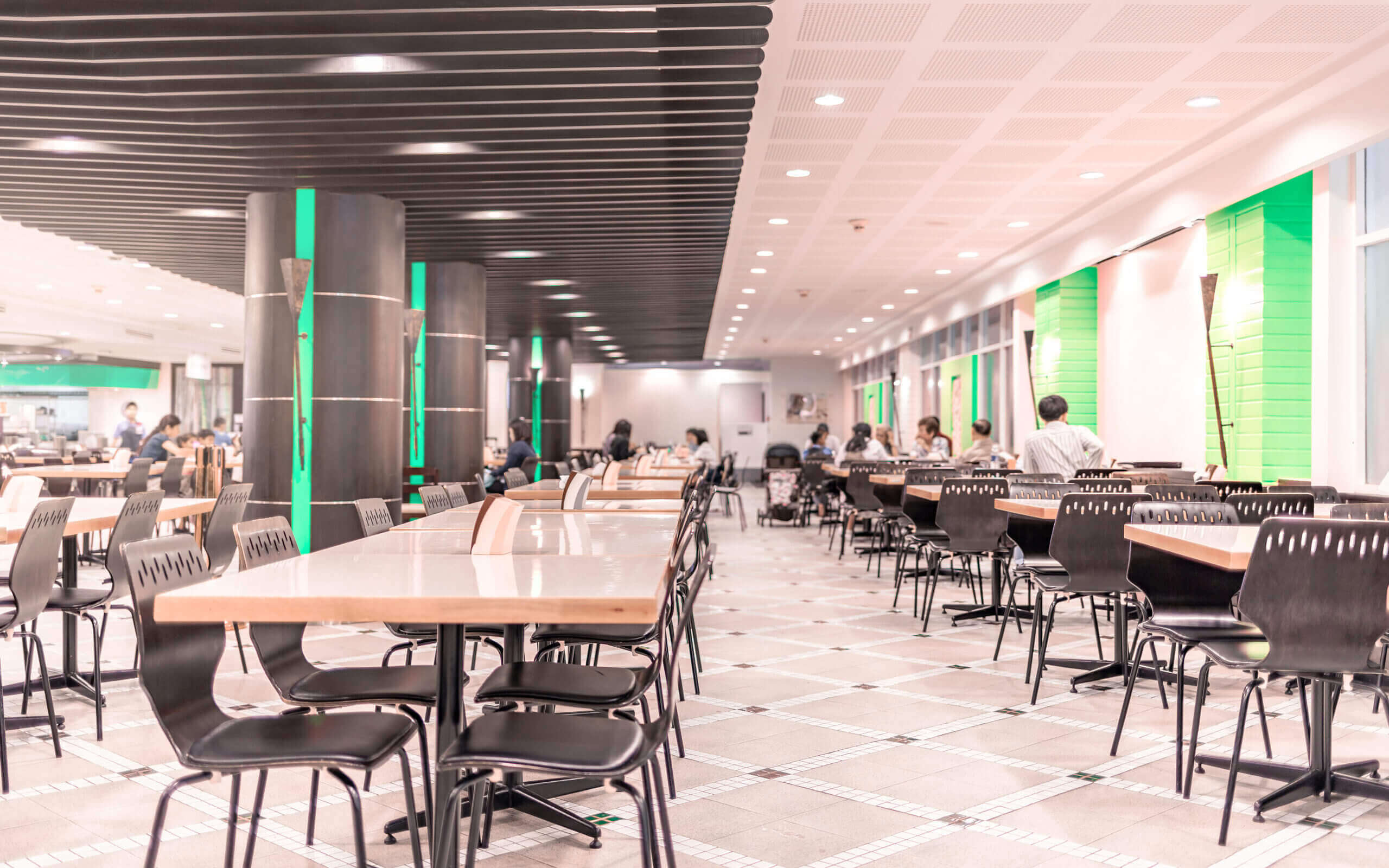 Modern interior of cafeteria or canteen with chairs and tables